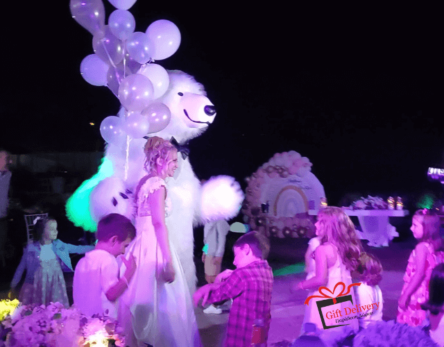 The White Polar Bear came to the wedding to deliver the gift to the bride and groom. Gift Delivery. Wedding gift. Surprise from the Political bear. White Polar Bear at the wedding.
